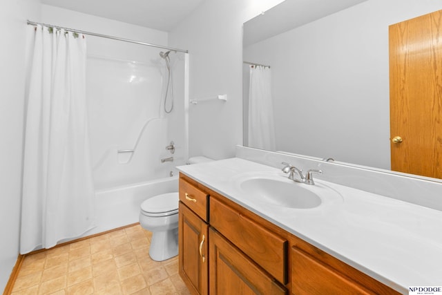 bathroom featuring toilet, shower / tub combo with curtain, and vanity