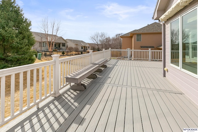 wooden terrace featuring a residential view