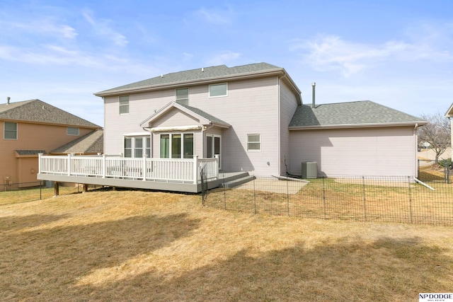 back of property featuring cooling unit, a wooden deck, a yard, and fence