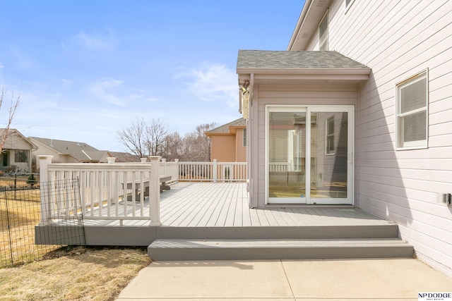 wooden terrace featuring fence