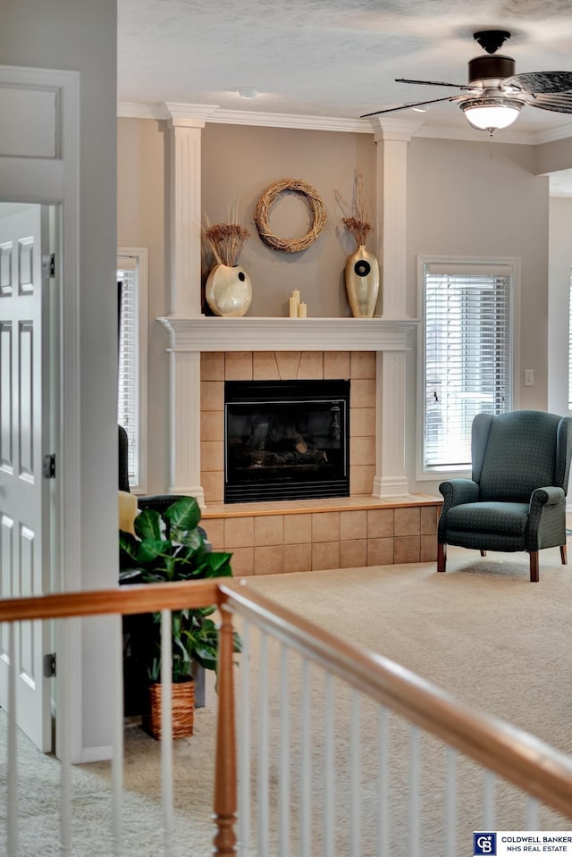 carpeted living room with a fireplace and crown molding