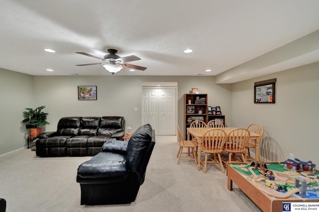 living area with light carpet, recessed lighting, and ceiling fan