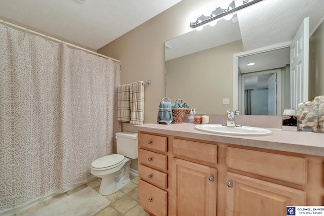 full bathroom with tile patterned floors, curtained shower, toilet, and vanity