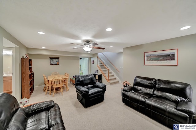 living room featuring recessed lighting, carpet, and stairs