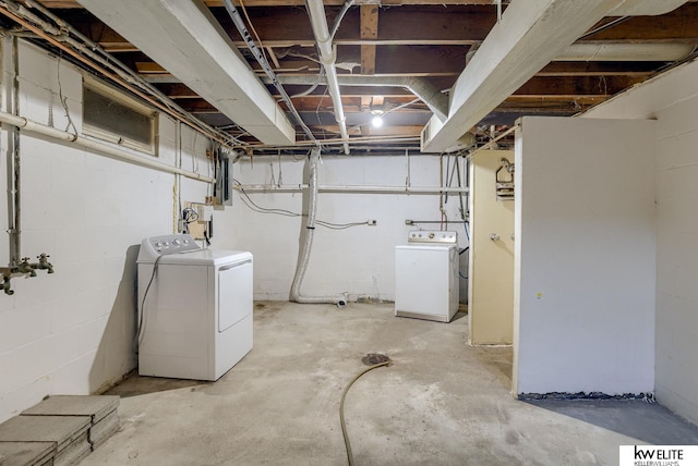 unfinished basement with washer and clothes dryer