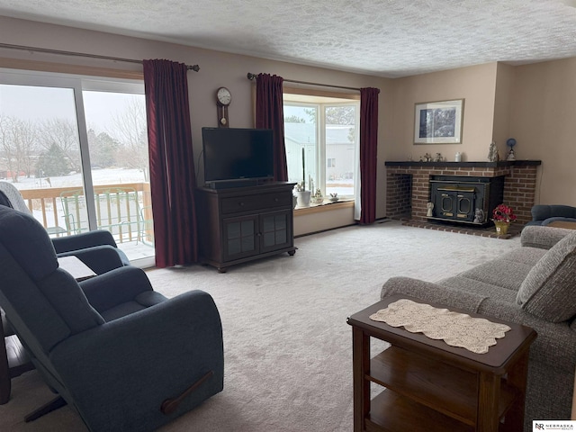 carpeted living area with a textured ceiling