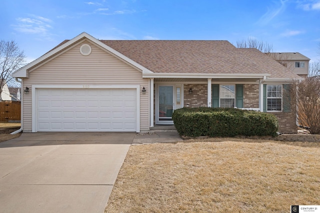 single story home featuring brick siding, driveway, a garage, and roof with shingles