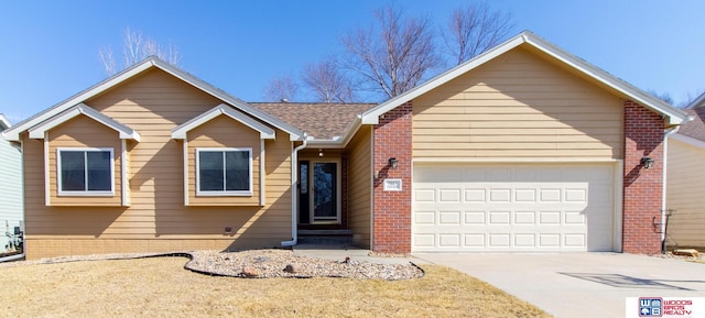 single story home featuring brick siding, an attached garage, concrete driveway, and roof with shingles