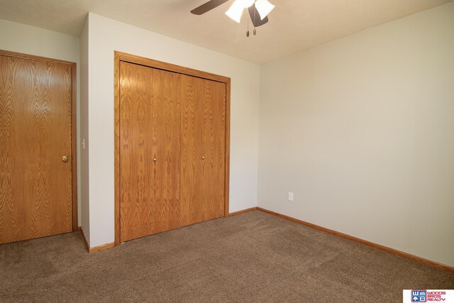 unfurnished bedroom featuring baseboards, a closet, carpet floors, and ceiling fan