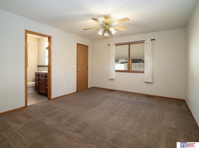 unfurnished bedroom featuring visible vents, connected bathroom, baseboards, carpet, and a ceiling fan