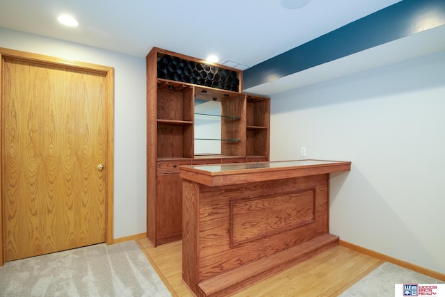 home office featuring recessed lighting, baseboards, and light wood-style floors