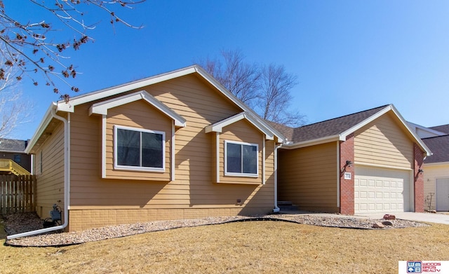 single story home with an attached garage, concrete driveway, and fence