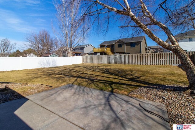 view of yard featuring a patio and a fenced backyard