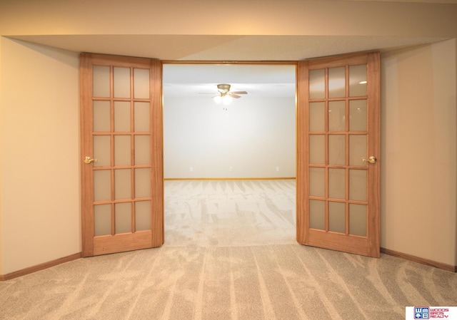 unfurnished room with carpet flooring, ceiling fan, and baseboards