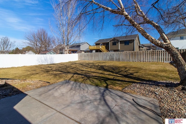 view of yard featuring a patio area and a fenced backyard