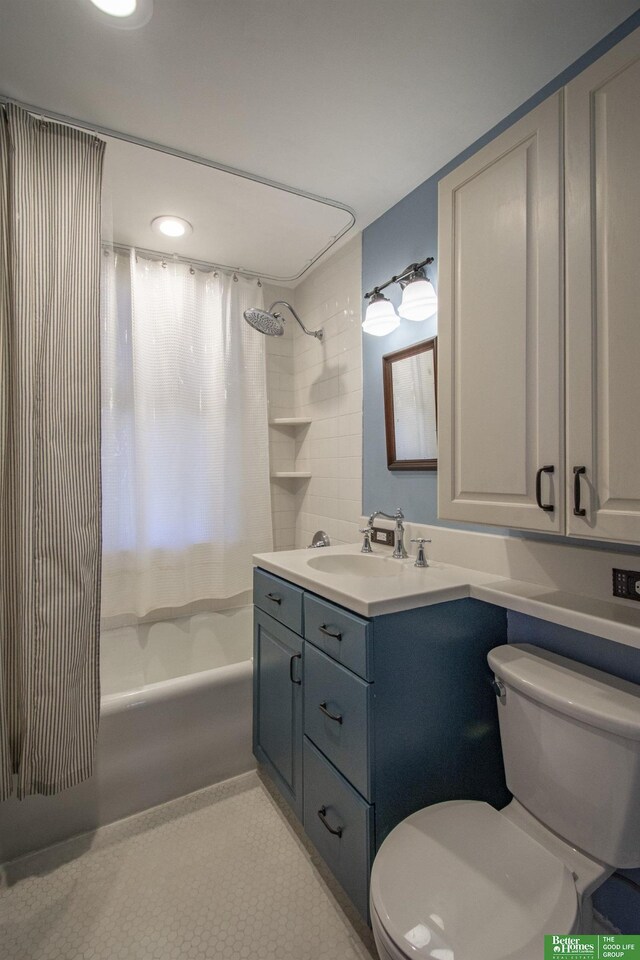 full bathroom with tile patterned flooring, vanity, toilet, and shower / tub combo with curtain