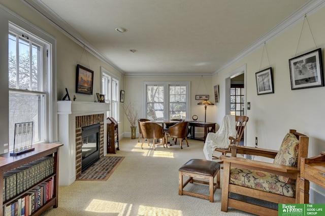 living area with carpet, a brick fireplace, and crown molding