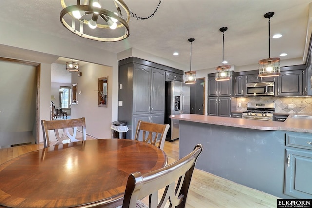 dining area featuring recessed lighting and light wood-type flooring