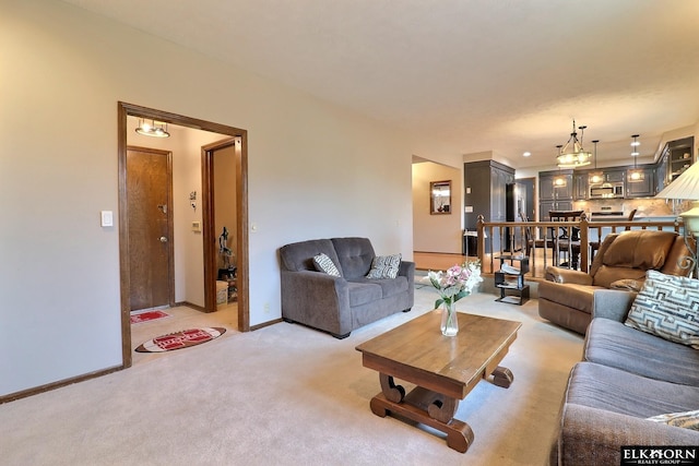 living area featuring light colored carpet and baseboards