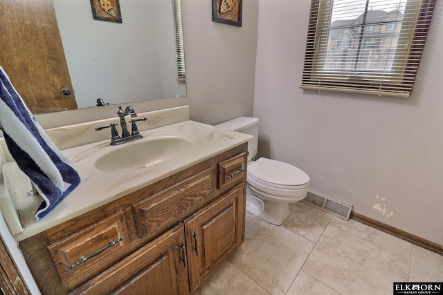 bathroom featuring visible vents, baseboards, toilet, tile patterned floors, and vanity