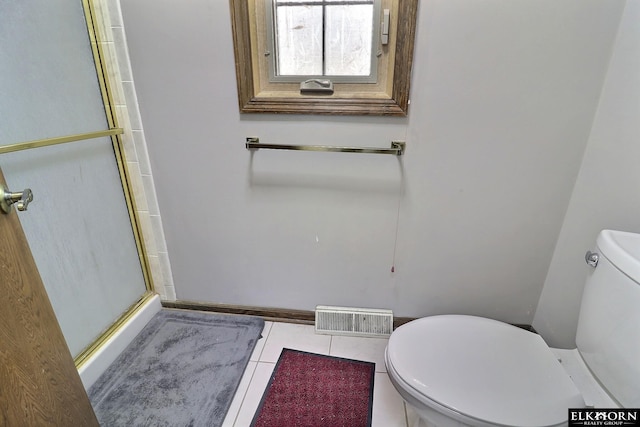 bathroom with an enclosed shower, visible vents, tile patterned floors, and toilet