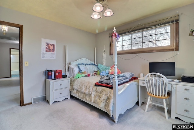 carpeted bedroom with visible vents and baseboards