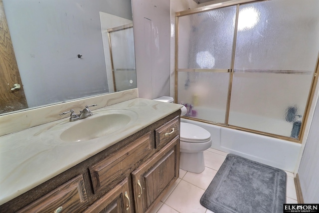 full bath featuring tile patterned floors, toilet, shower / bath combination with glass door, and vanity