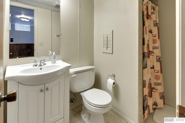 bathroom featuring vanity, tile patterned floors, toilet, and a shower with curtain