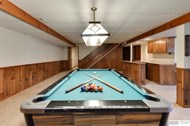 rec room with a wainscoted wall, light carpet, wood walls, and billiards