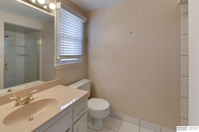 full bathroom with vanity, toilet, a shower stall, and tile patterned flooring