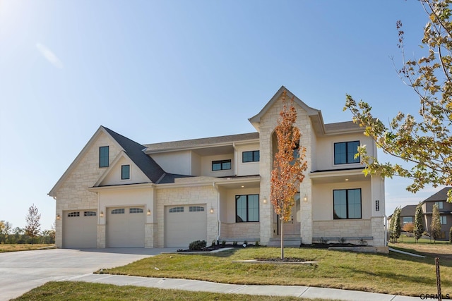 view of front of property with a front yard, stone siding, driveway, and stucco siding