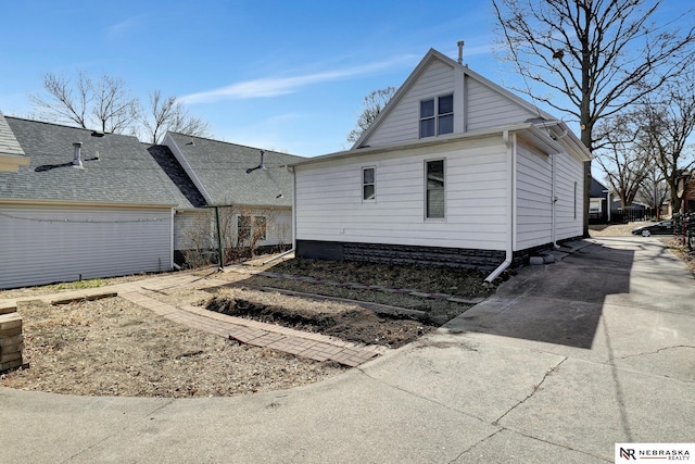 exterior space with concrete driveway