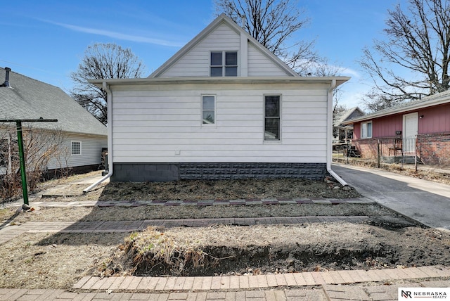 view of side of property featuring driveway