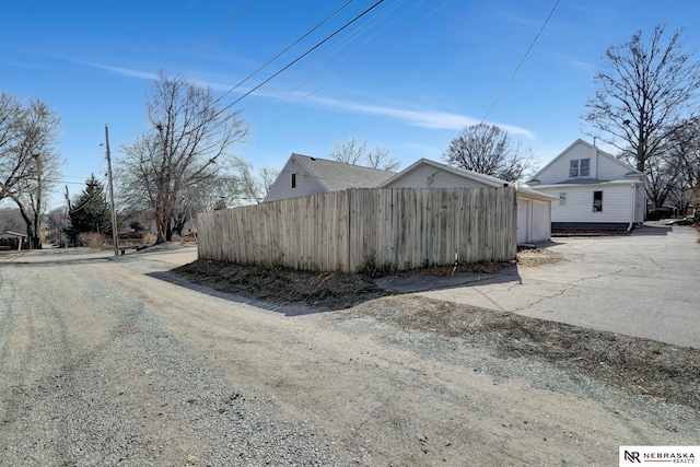 view of home's exterior featuring fence