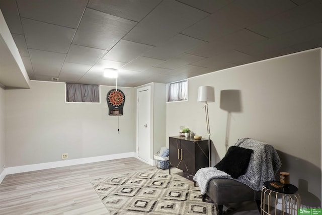 sitting room featuring light wood-style floors and baseboards