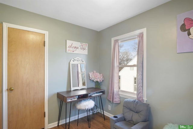 interior space featuring wood finished floors and baseboards