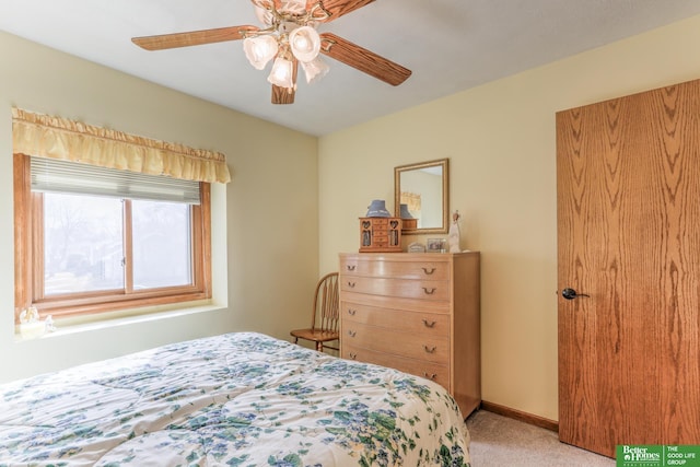 bedroom with light carpet, baseboards, and ceiling fan