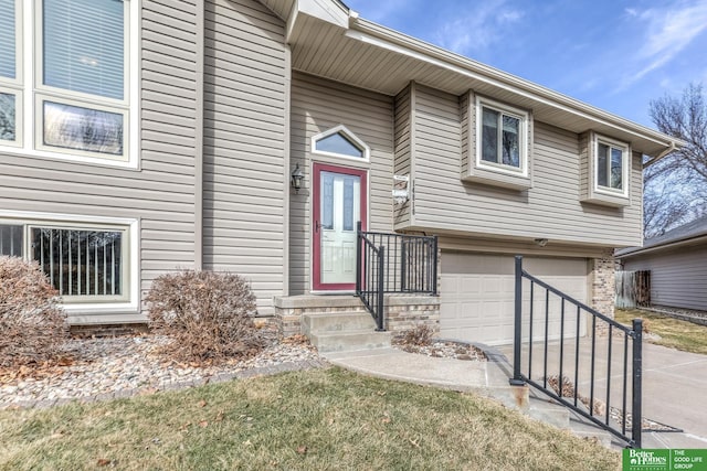 view of exterior entry with an attached garage