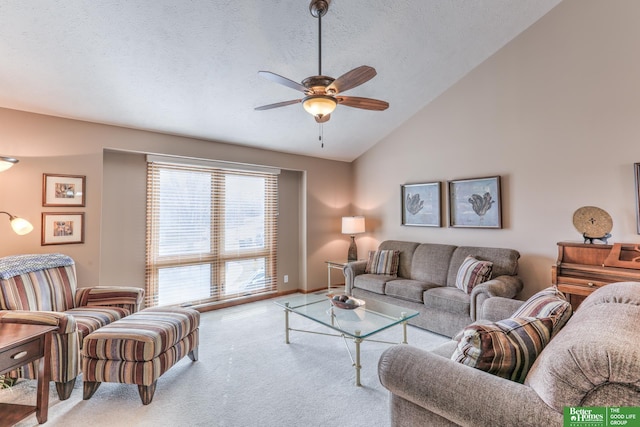 carpeted living room featuring vaulted ceiling, a ceiling fan, and a textured ceiling