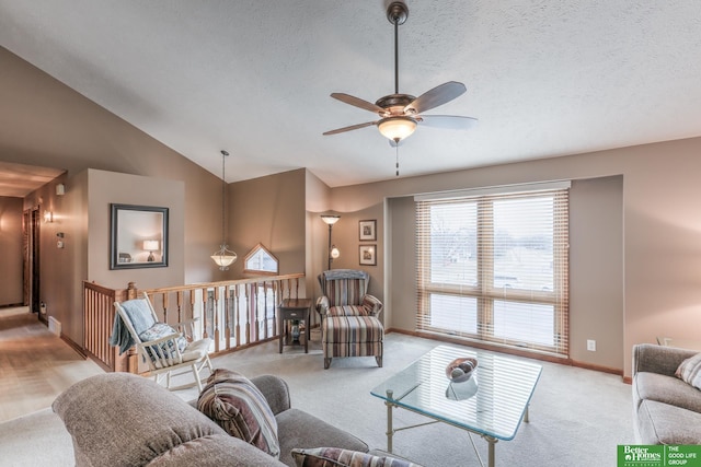 carpeted living room with baseboards, lofted ceiling, a textured ceiling, and a ceiling fan