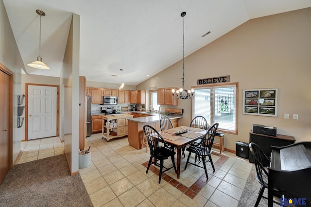 dining room featuring light tile patterned flooring, baseboards, visible vents, and high vaulted ceiling