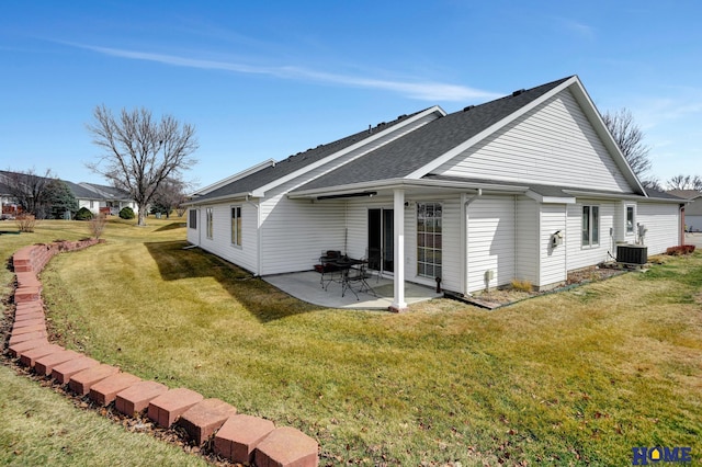 back of house with a yard, a patio, central AC, and a shingled roof