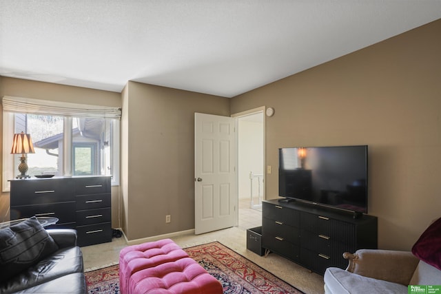 living room with baseboards and light carpet