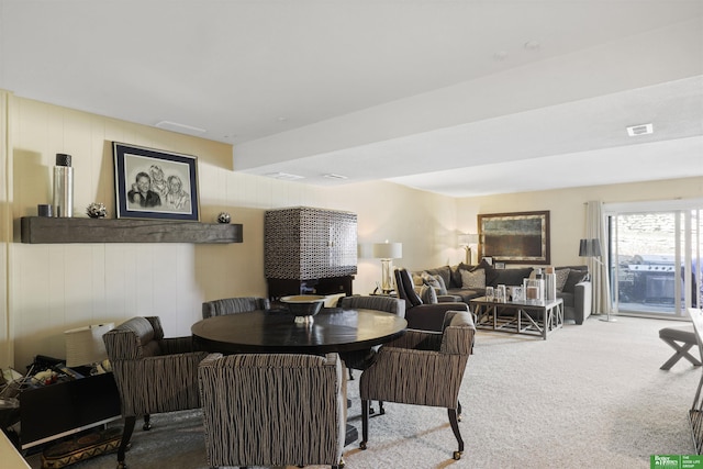 dining area featuring carpet and visible vents