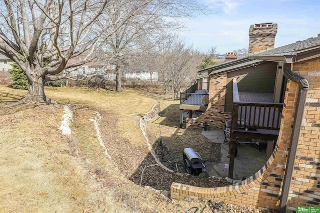 view of yard featuring a wooden deck