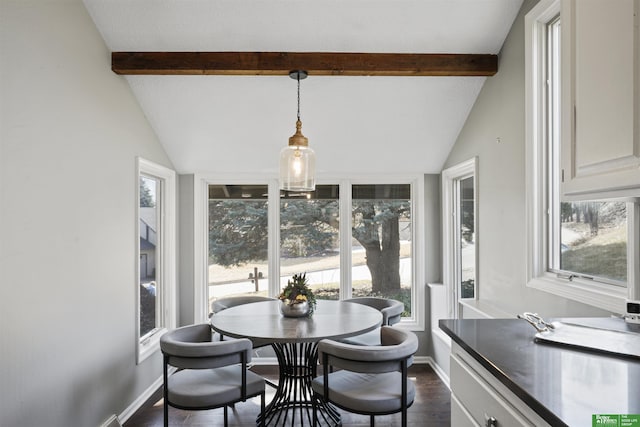 dining area with lofted ceiling with beams, baseboards, and dark wood-type flooring