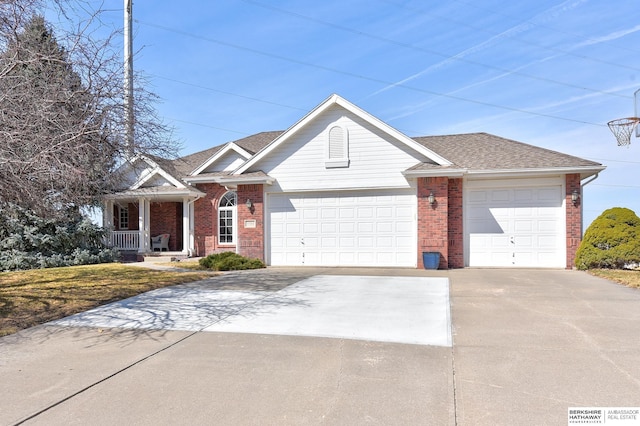 ranch-style house featuring a porch, roof with shingles, concrete driveway, a garage, and brick siding