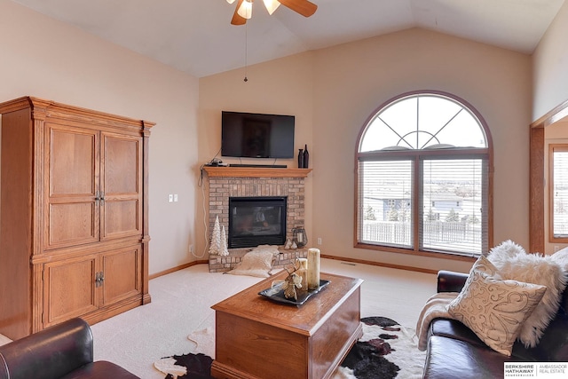 living area featuring lofted ceiling, a fireplace, baseboards, light colored carpet, and ceiling fan