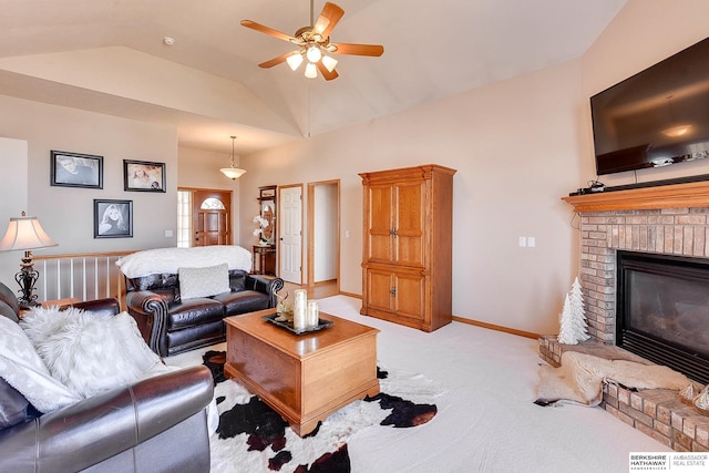 living room featuring baseboards, a fireplace, ceiling fan, vaulted ceiling, and light carpet