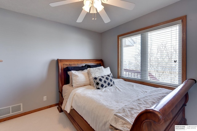 bedroom with visible vents, ceiling fan, carpet, and baseboards